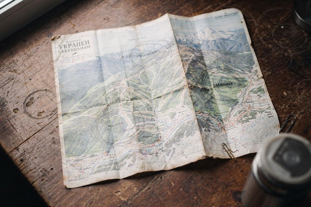 Folded paper piste map of the Carpathians with four resort names circled in pencil
